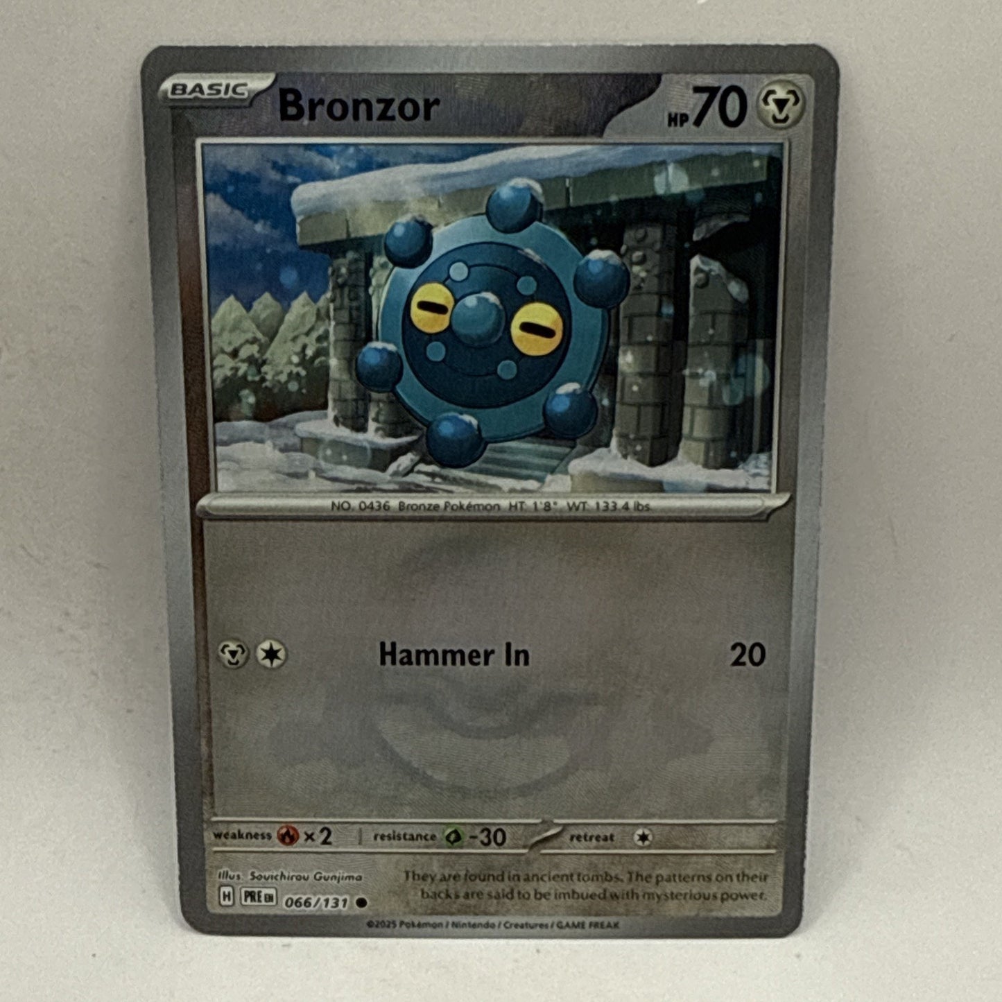 Pokemon Bronzor (Master Ball Pattern) SV: Prismatic Evolutions 066/131 LP Card